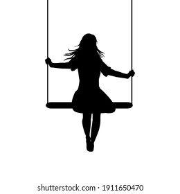 A young woman silhouette who is swinging