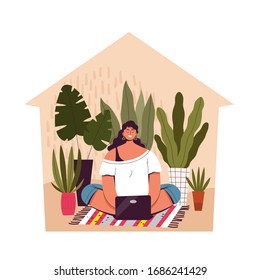 A young woman sits at home and works remotely. Concept activity and telecommuting, freelancing during quarantine and isolation of coronavirus