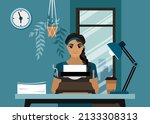 A young woman sits at a table and types a future book on a typewriter. The writer is working. Writer