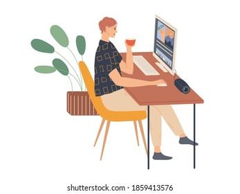 Young woman sits and works at a computer