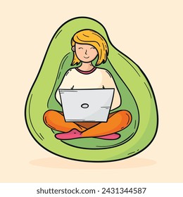 Young woman sitting in a bean bag chair working from home on laptop. Woman in Turkish sitting pose on a beanbag sofa