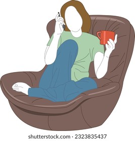 A young woman is sitting comfortably in a chair, drinking coffee and talking on the phone