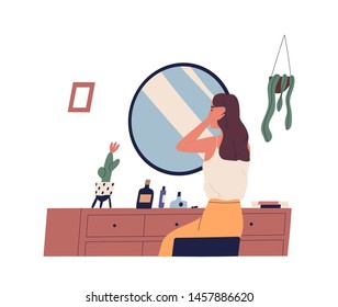 Young woman sitting at dressing table and primping her hair. Cute girl making hairstyle in front of mirror. morning routine, start of working day, everyday life. Flat cartoon vector illustration.