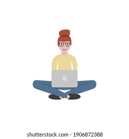 young woman sitting in front of laptop working