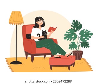 Young woman sitting on armchair 
 with cat and reading book at home