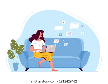 A young woman is sitting on the couch, holding a laptop and texting by email. The concept of remote work