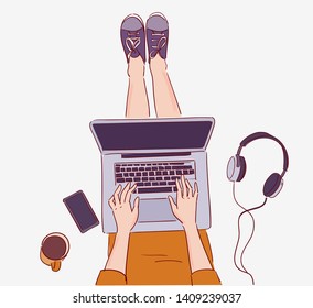 Young woman sitting on floor and working on laptop computer