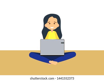 young woman sitting on on the floor with legs crossed while using laptop.  Vector illustration in a modern flat style.