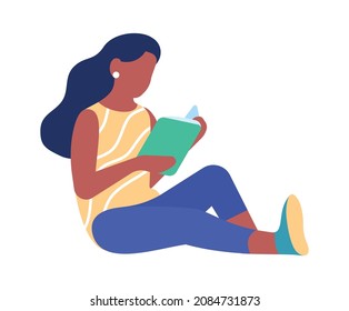 Young woman sitting on floor with book. Relaxing comfortable reading