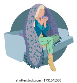 Young woman sitting on a modern chair relaxing in her living room drinking coffee or tea. Young girl wrapped in a plaid. Home comfort. Stay at home. Girl under the covers.Stay at home. Comfort at home