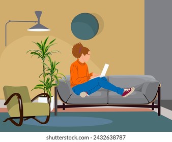 Young woman sitting on the sofa with laptop. 