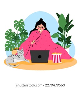 Young woman sitting in a pink blanket and watching a movie on laptop. House plant on background. Chilling at home concept.