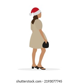 A young woman in a smart dress, with a handbag in her hand and a santa hat, stands on a white background