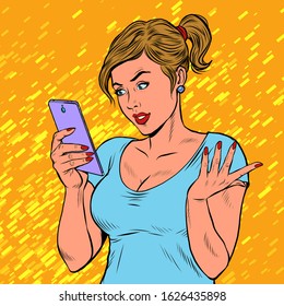 A young woman with a smartphone. Techniques and gadgets. Pop art retro vector illustration 50s 60s style