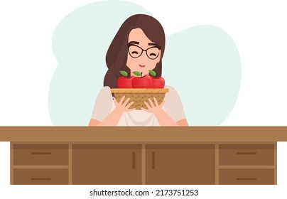 Young woman are smelling apples