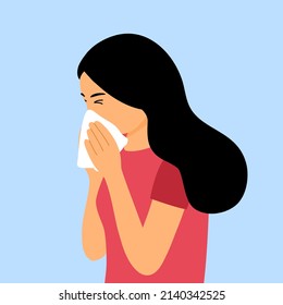 Young woman sneezing in handkerchief. Flu, cold or season allergy.