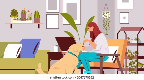 young woman spending time with dog female owner and cute domestic animal friendship with pet concept