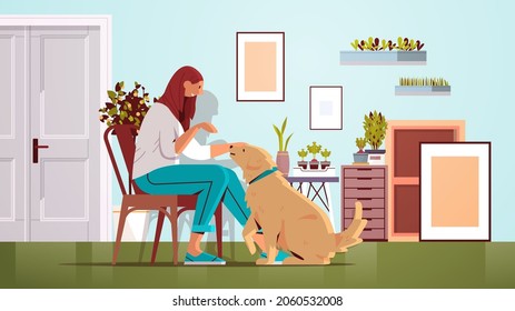 young woman spending time with dog female owner and cute domestic animal friendship with pet concept