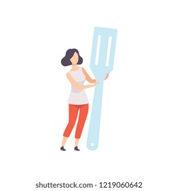 Young woman standing with a giant spatula, faceless girl in casual clothes holding kitchen tool vector Illustration on a white background