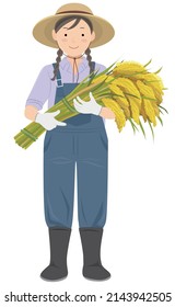 A young woman standing with a rice bundle