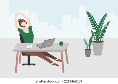 Young woman stretching at workplace in office. Female employee with headphone with microphone sitting at desk with laptop and stretching legs, arms during coffee break. Remote work, rest, job concept