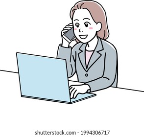 A young woman in suit talking on the phone, using her laptop