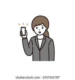 A young woman in a suit who is in trouble with a smartphone