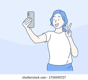 Young woman taking a selfie while standing. Friendship and youth concept. Hand drawn in thin line style, vector illustrations.