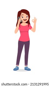 young woman talking using smartphone and show ok gesture