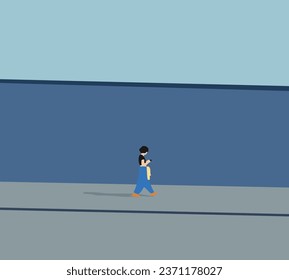 Young woman texting massage on her phone while walking down city street with blue wall background. Teenage lifestyle concept.