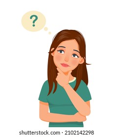 young woman thinking looking up while touching her chin to find solution of problems
