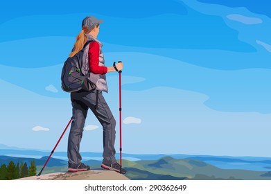 Young woman tourist standing on mountain top and looking aside.