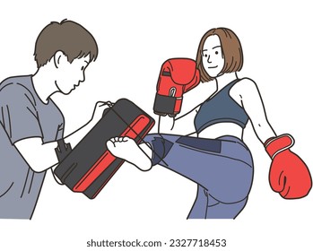 
Young woman and trainer doing martial arts kicks