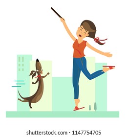 Young Woman Training Her Dog