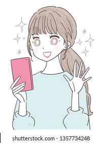 A young woman uses a smartphone. She is pleased.