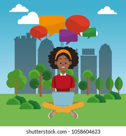 Young woman using laptop at park