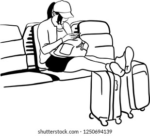 A young woman is using a mobile phone while waiting on row chair with her leg on the baggage.