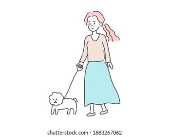 Young woman walking with dog