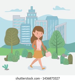 young woman walking with handbag in the park