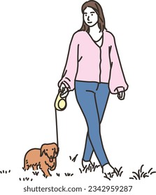 Young woman walking her dog outdoors
