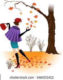 A young woman walks in autumn park. She catches falling from a tree leaves.