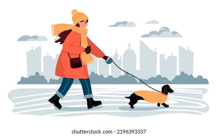 Young woman walks a dachshund dog in a city park.Characters in warm clothes.The concept of outdoor walks with her beloved pet in cold season.Background with city silhouette .Vector flat illustration.