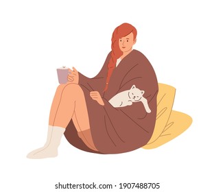 Young woman in warm socks and wrapped in cozy blanket holding tea cup. Female character relaxing with cat and drinking hot beverage at home. Flat vector illustration isolated on white background