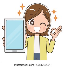 Young woman wearing a yellow cardigan.She uses a smartphone.