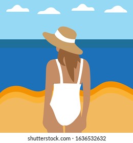 Young woman in a white swimsuit on the beach