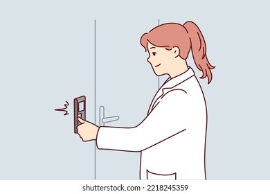 Young woman in white uniform switch controller near door. Smiling female researcher or scientist turn on control panel on wall. Vector illustration. 