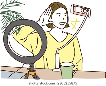 A young woman who distributes videos on a smartphone
