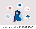 Young woman who suffers from mental health diseases is sitting on the floor. Girl surrounded by symptoms of depression disorder: anxiety, crisis, tears, exhaustion, loss,  overworked, tired.