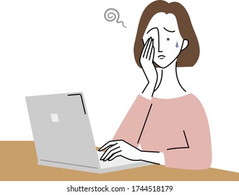 a young woman whose eyes are tired by using a computer