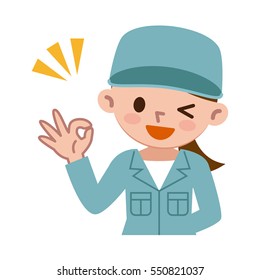 Young woman in work clothes is issuing an OK sign